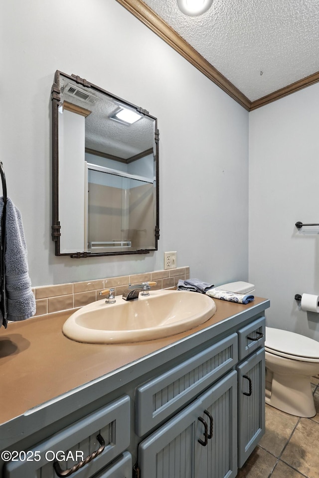 5623 Rivercrest Valley Dr, Joplin, MO 64804 - full bath with ornamental molding, vanity, a shower with shower door, a textured ceiling, and tile patterned floors
