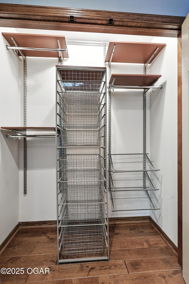 5623 Rivercrest Valley Dr, Joplin, MO 64804 - walk in closet featuring hardwood / wood-style flooring