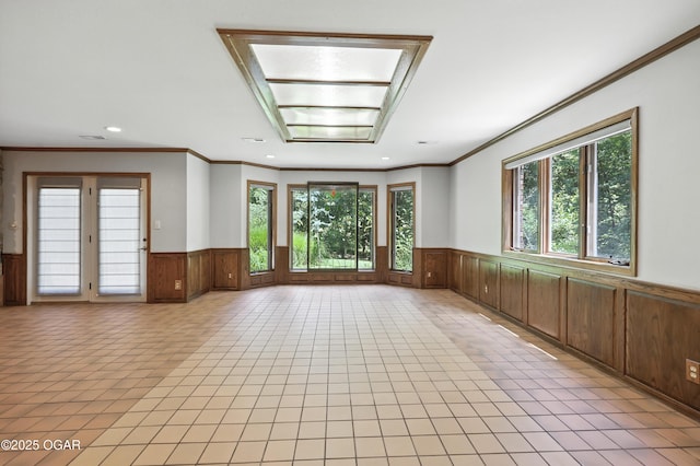 5623 Rivercrest Valley Dr, Joplin, MO 64804 - spare room featuring wainscoting, crown molding, recessed lighting, and light tile patterned floors