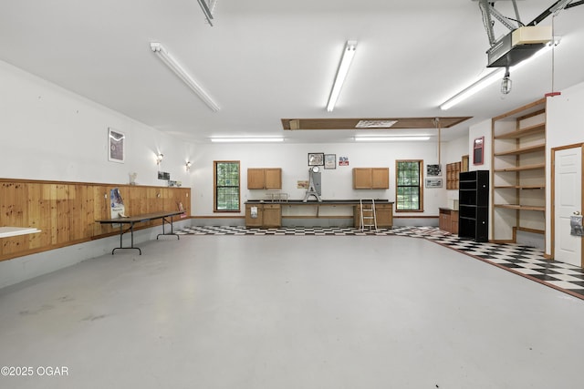 5623 Rivercrest Valley Dr, Joplin, MO 64804 - garage featuring a garage door opener and a sink