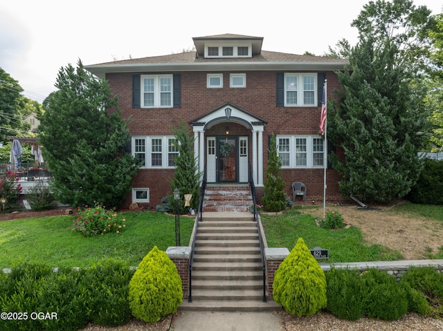 629 W Islington Pl, Joplin, MO 64801 - view of front of home with brick siding and a front lawn