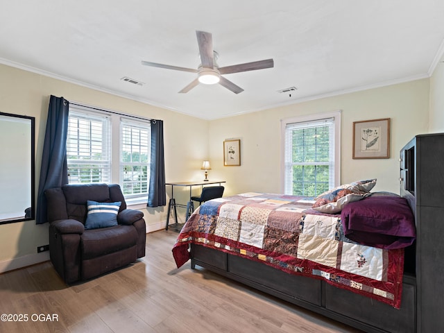 629 W Islington Pl, Joplin, MO 64801 - bedroom with wood finished floors, crown molding, and ceiling fan