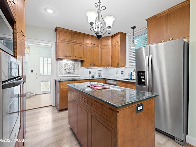 629 W Islington Pl, Joplin, MO 64801 - kitchen with appliances with stainless steel finishes, brown cabinetry, and recessed lighting