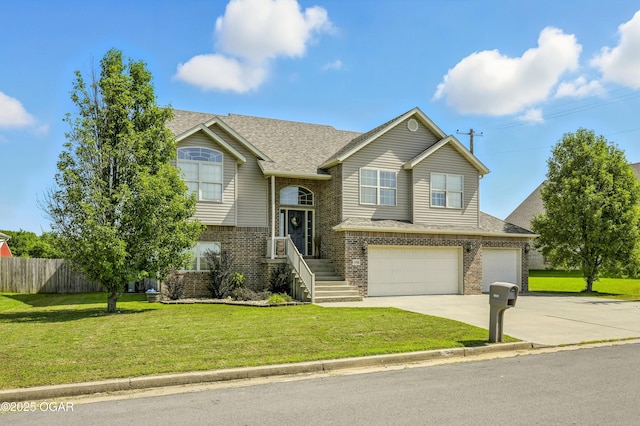 2256 N Greystone Sq, Webb City, MO 64870 - raised ranch with brick siding, driveway, an attached garage, and a shingled roof