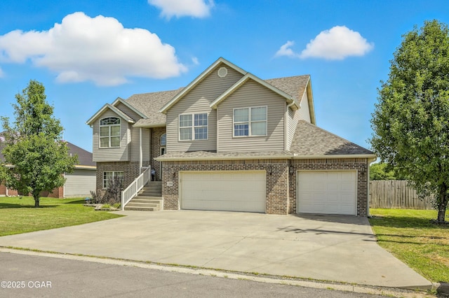 2256 N Greystone Sq, Webb City, MO 64870 - view of front of house with brick siding, concrete driveway, a garage, and a shingled roof