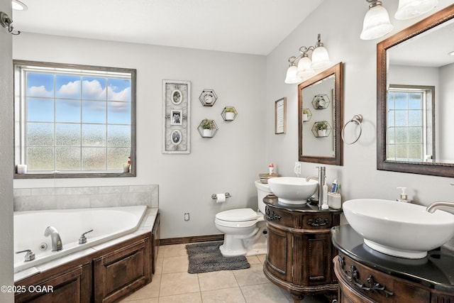 2256 N Greystone Sq, Webb City, MO 64870 - bathroom with a whirlpool tub, two vanities, and tile patterned floors