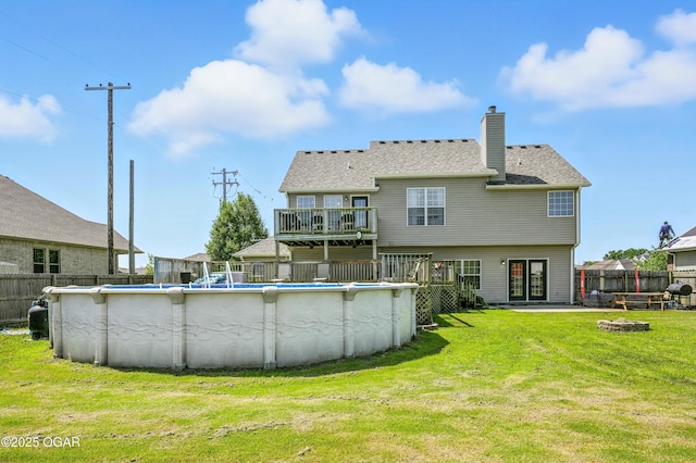 2256 N Greystone Sq, Webb City, MO 64870 - back of property featuring a fire pit, a fenced backyard, and a chimney
