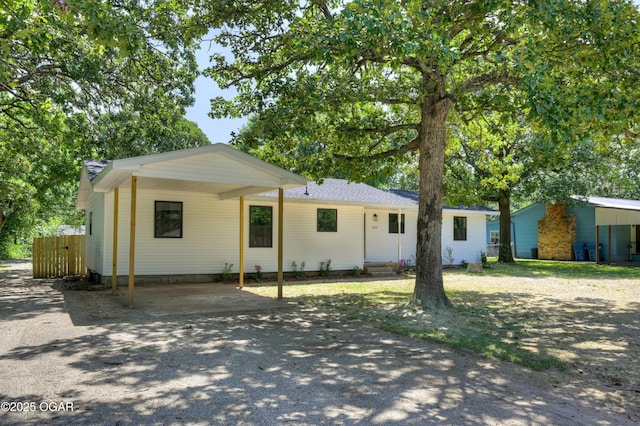 233 Timber Ln, Carl Junction, MO 64834 - single story home featuring asphalt driveway and an attached carport