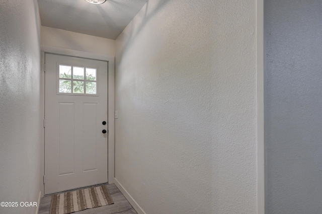 233 Timber Ln, Carl Junction, MO 64834 - doorway featuring wood finished floors and baseboards