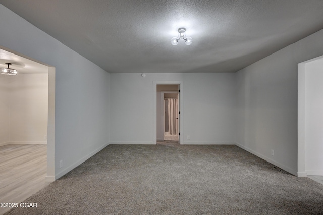 233 Timber Ln, Carl Junction, MO 64834 - carpeted empty room with a textured ceiling and baseboards