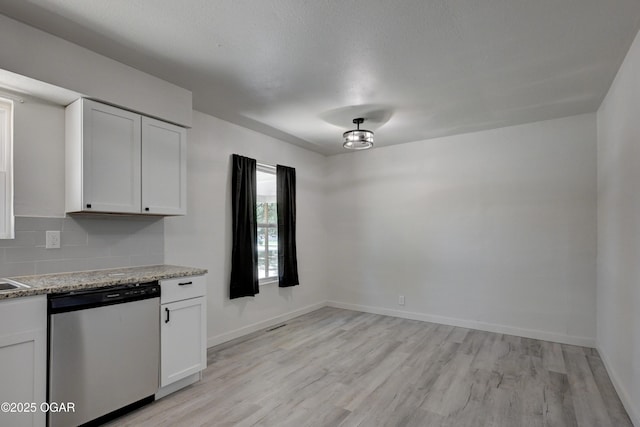 233 Timber Ln, Carl Junction, MO 64834 - kitchen with dishwasher, light wood-type flooring, white cabinetry, tasteful backsplash, and light stone countertops