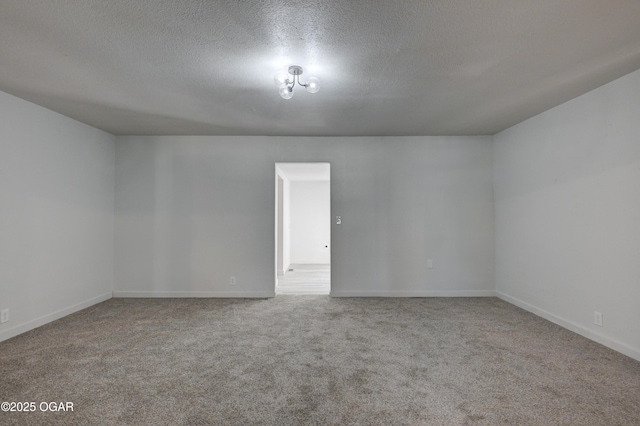 233 Timber Ln, Carl Junction, MO 64834 - carpeted empty room with a textured ceiling