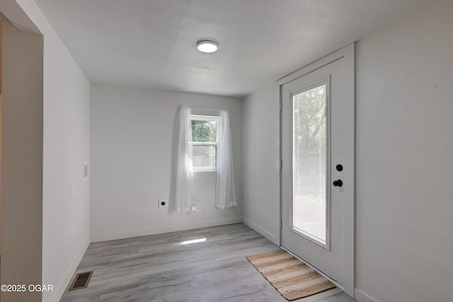 233 Timber Ln, Carl Junction, MO 64834 - doorway with light wood-type flooring and baseboards