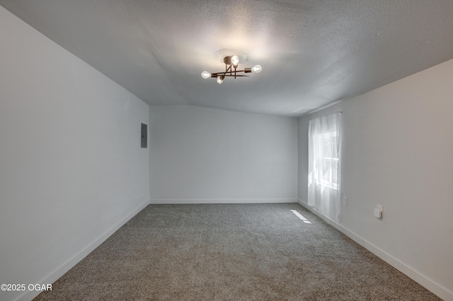 233 Timber Ln, Carl Junction, MO 64834 - unfurnished room with carpet, a textured ceiling, and a chandelier