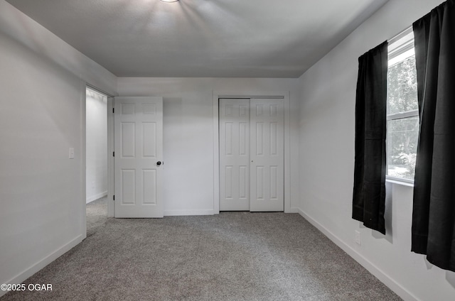 233 Timber Ln, Carl Junction, MO 64834 - unfurnished bedroom featuring carpet flooring and a closet