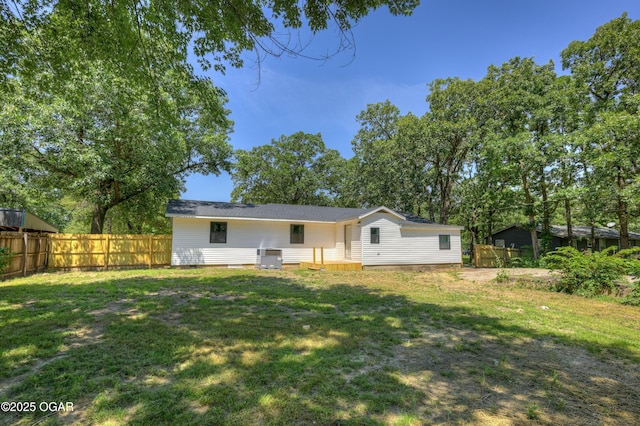 233 Timber Ln, Carl Junction, MO 64834 - rear view of house with a fenced backyard