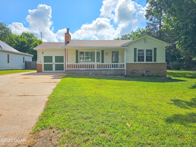2507 N Ozark Ave, Joplin, MO 64801 - view of front of property with covered porch, brick siding, a chimney, and concrete driveway