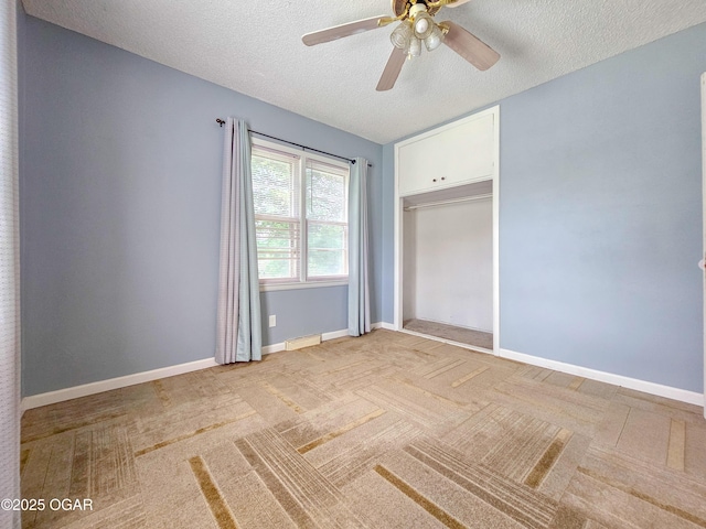 2507 N Ozark Ave, Joplin, MO 64801 - unfurnished bedroom featuring light colored carpet, a textured ceiling, and ceiling fan