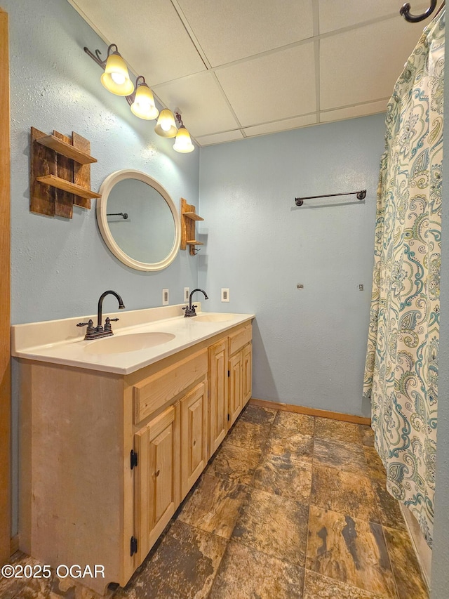 2507 N Ozark Ave, Joplin, MO 64801 - full bathroom featuring double vanity, a paneled ceiling, and stone finish flooring