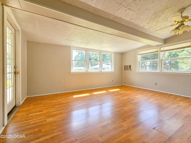 2507 N Ozark Ave, Joplin, MO 64801 - spare room with light wood finished floors, healthy amount of natural light, a ceiling fan, and beamed ceiling