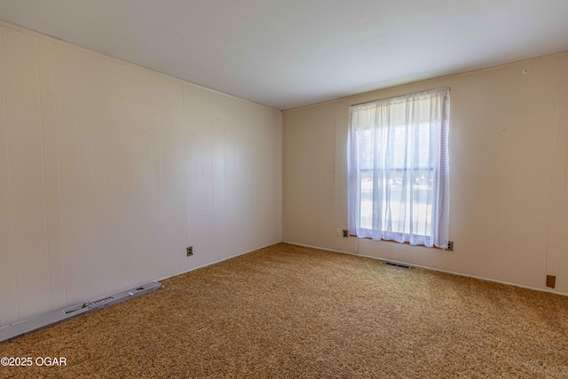 400 Broadway St, Lamar, MO 64759 - carpeted spare room with wooden walls