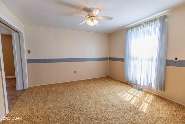 400 Broadway St, Lamar, MO 64759 - empty room featuring a ceiling fan and carpet floors