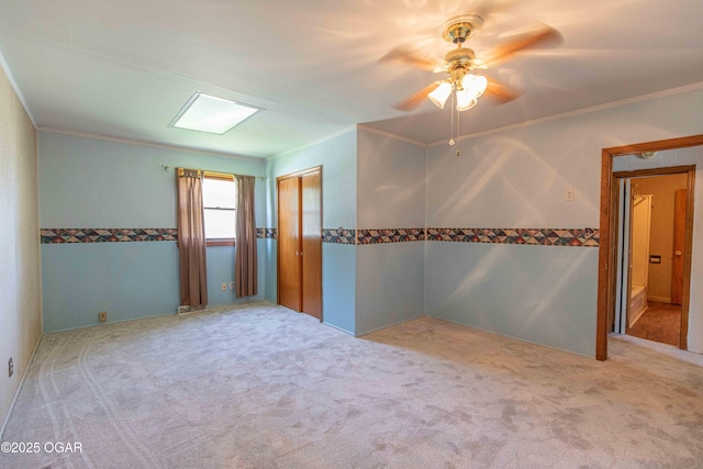 400 Broadway St, Lamar, MO 64759 - empty room with ornamental molding, carpet flooring, and a ceiling fan