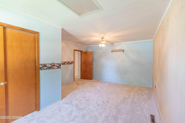 400 Broadway St, Lamar, MO 64759 - carpeted spare room with crown molding and ceiling fan