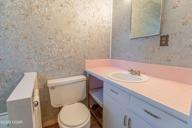400 Broadway St, Lamar, MO 64759 - half bath with vanity and wallpapered walls