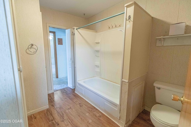 400 Broadway St, Lamar, MO 64759 - bathroom with wood finished floors and bathtub / shower combination