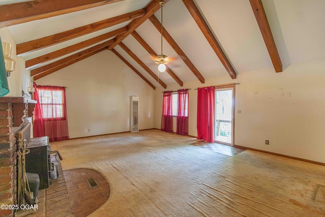 400 Broadway St, Lamar, MO 64759 - unfurnished living room featuring carpet, beamed ceiling, healthy amount of natural light, high vaulted ceiling, and ceiling fan