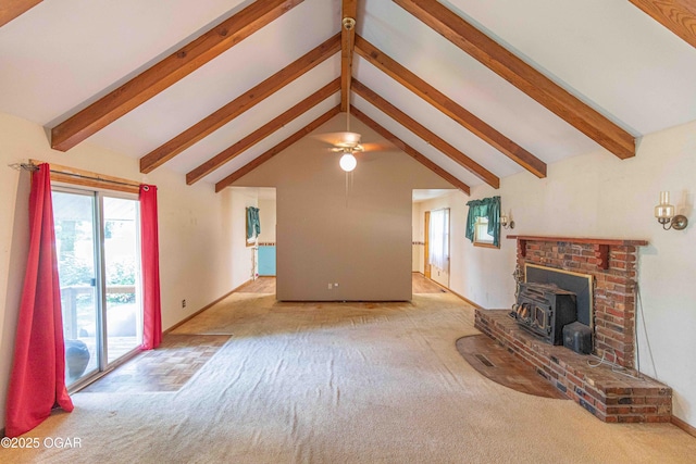 400 Broadway St, Lamar, MO 64759 - unfurnished living room featuring carpet flooring, a wood stove, and ceiling fan