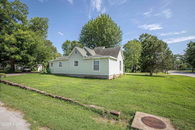 400 Broadway St, Lamar, MO 64759 - view of side of property featuring a yard and roof with shingles