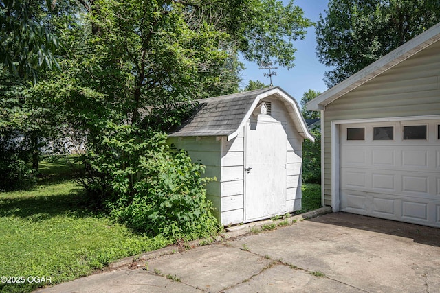 400 Broadway St, Lamar, MO 64759 - garage with a storage shed and driveway