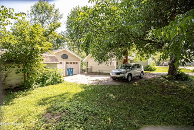 400 Broadway St, Lamar, MO 64759 - view of grassy yard with an outbuilding and driveway