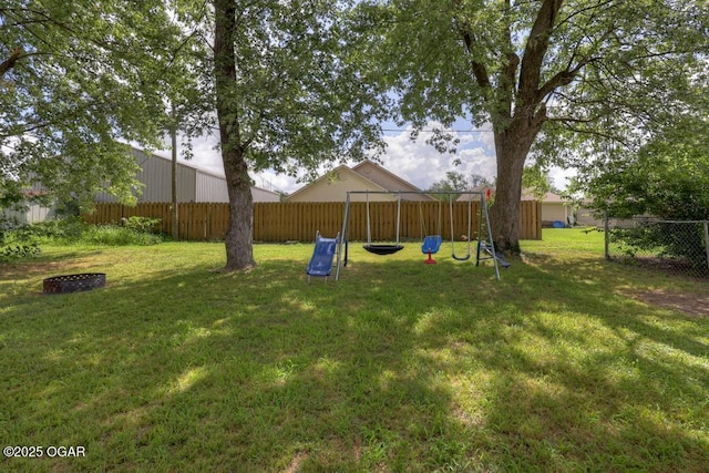 715 Wilson St, Webb City, MO 64870 - fenced backyard with a playground