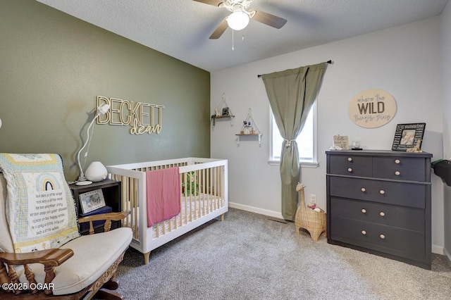 715 Wilson St, Webb City, MO 64870 - carpeted bedroom featuring a nursery area and ceiling fan