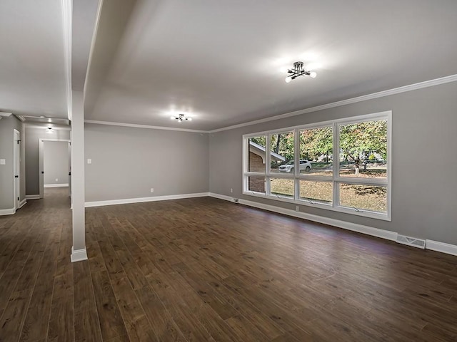 unfurnished living room featuring ornamental molding and dark hardwood / wood-style floors