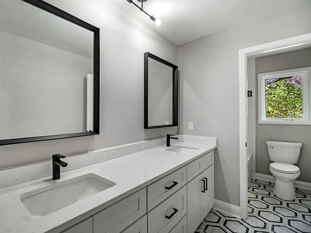 bathroom with vanity and toilet