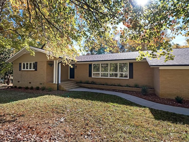 ranch-style house with a front lawn