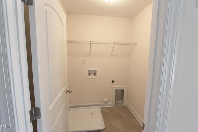 clothes washing area with electric dryer hookup, washer hookup, and tile patterned floors