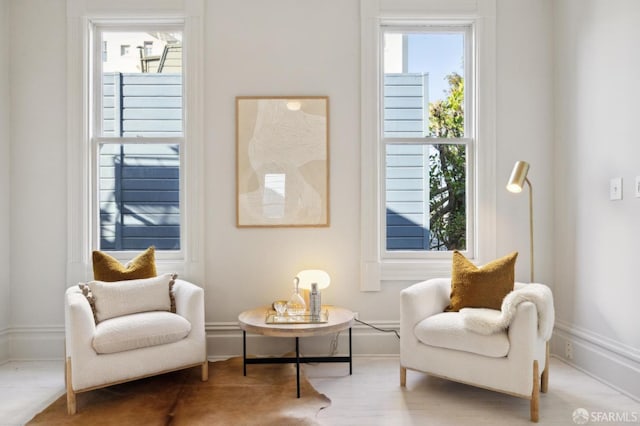 sitting room with hardwood / wood-style flooring