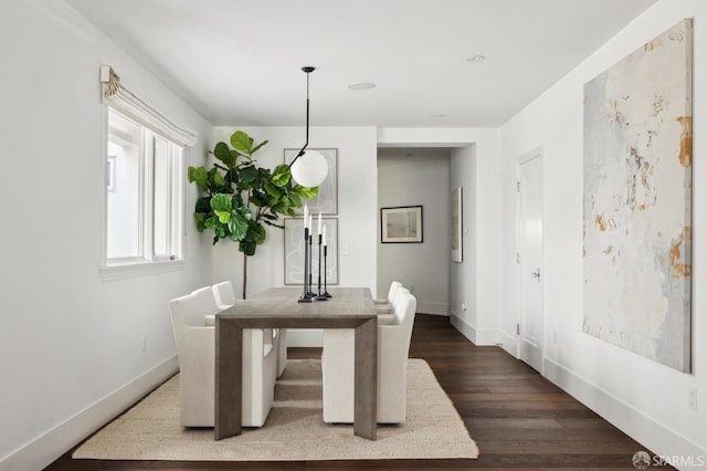 dining space featuring dark hardwood / wood-style floors