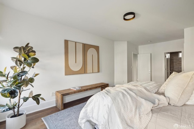 bedroom with hardwood / wood-style floors