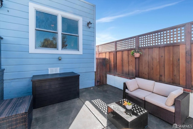 view of patio / terrace with fence and an outdoor hangout area