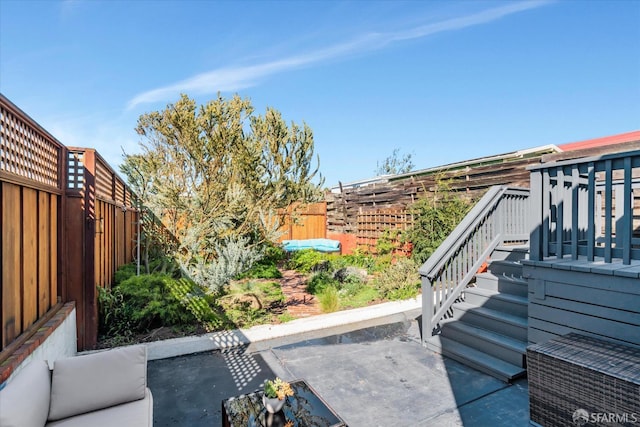 exterior details featuring stairway and a fenced backyard