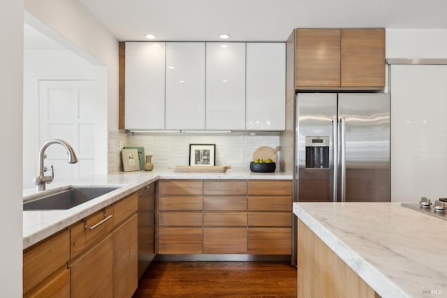 1837 Centro W St, Tiburon, CA 94920 - kitchen with light stone countertops, a sink, stainless steel refrigerator with ice dispenser, and tasteful backsplash