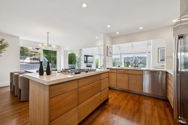 1837 Centro W St, Tiburon, CA 94920 - kitchen with light countertops, a sink, appliances with stainless steel finishes, modern cabinets, and dark wood-type flooring
