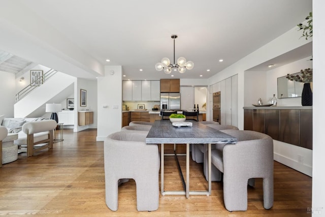 1837 Centro W St, Tiburon, CA 94920 - kitchen with open floor plan, light wood-style flooring, a notable chandelier, and stainless steel refrigerator with ice dispenser