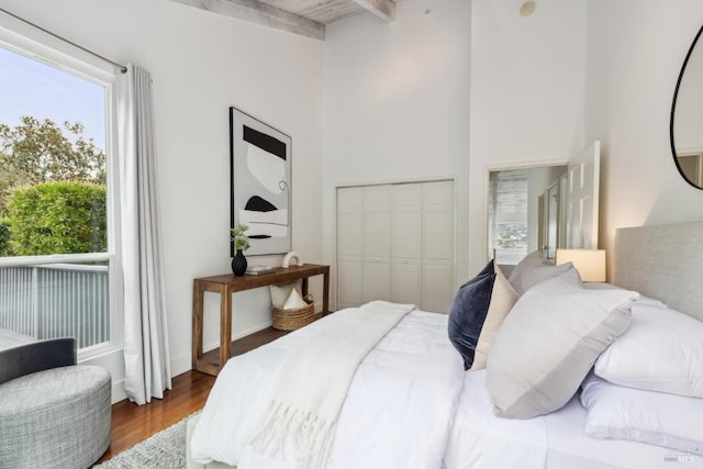 1837 Centro W St, Tiburon, CA 94920 - bedroom with beamed ceiling, a closet, wood finished floors, and a towering ceiling